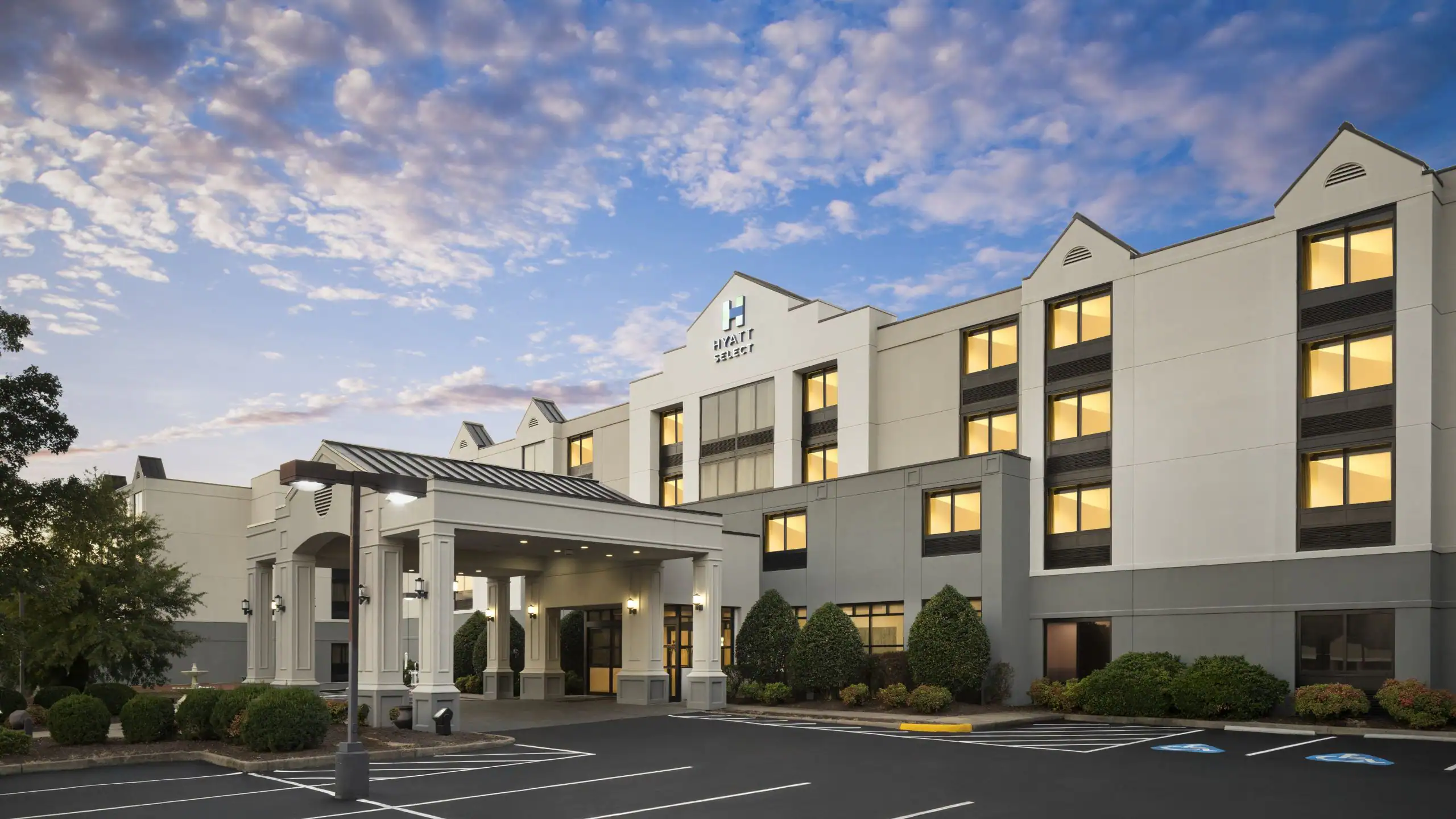 Hyatt Select St. Robert exterior at dusk